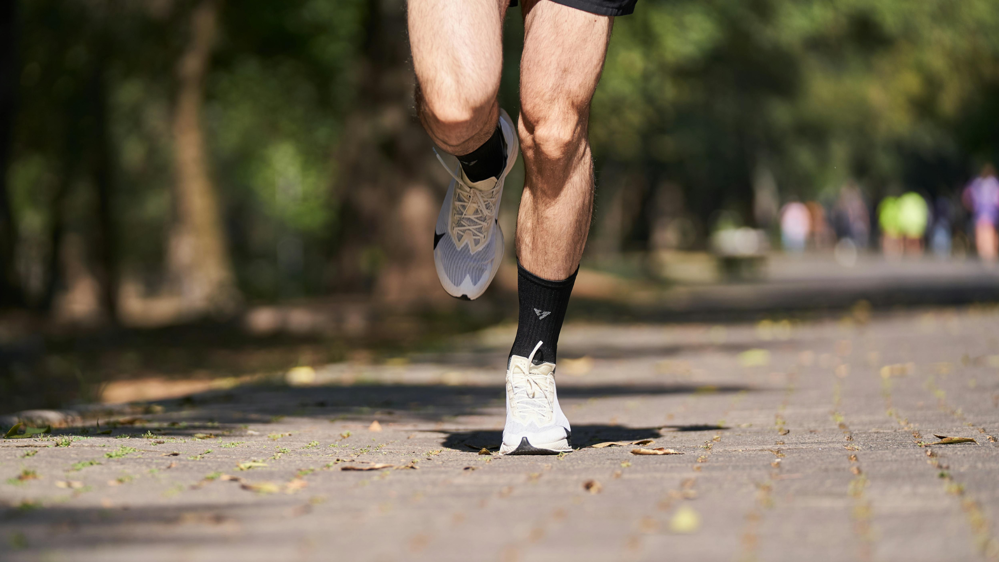 Person running in proper running shoes
